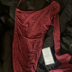 A maroon , prom dress. I high slight and one shoulder. Comfortable and stretchy.